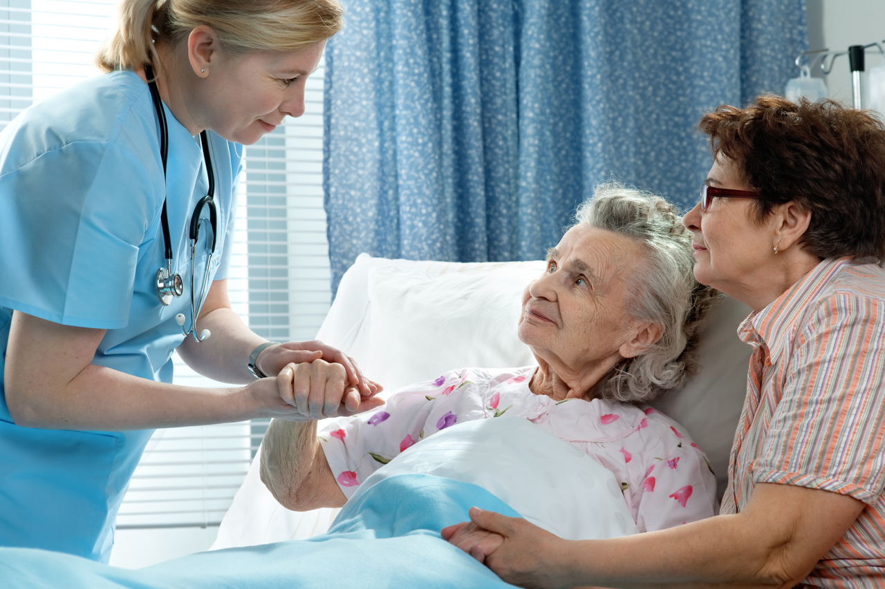 caregiver-nurse-talking-to-patient